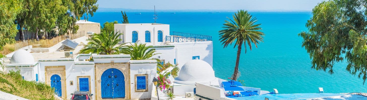 Traditional Tunisian house against turquoise sea