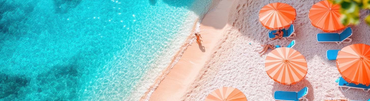 Golden sandy beach with sun loungers & umbrellas