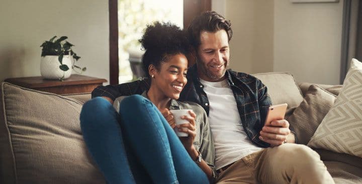 Couple looking at mobile phone