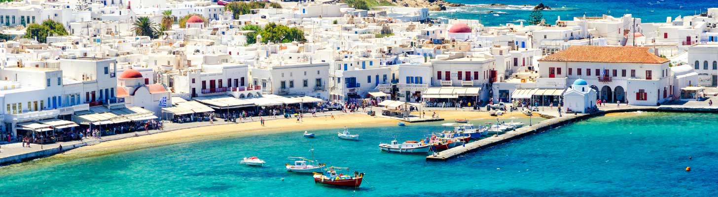 Whitewashed buildings along the promenade in Mykonos