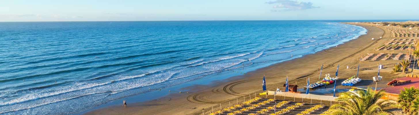 Sandy beaches & calm seas of Playa del Ingles beach in Tenerife