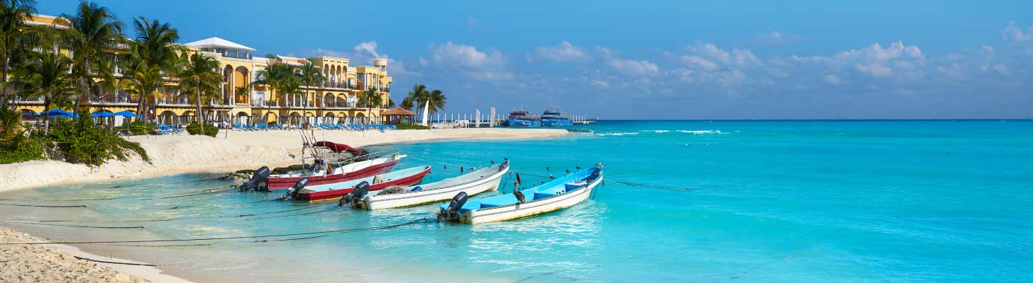 Boats on Playa del Carmen beach in Mexico